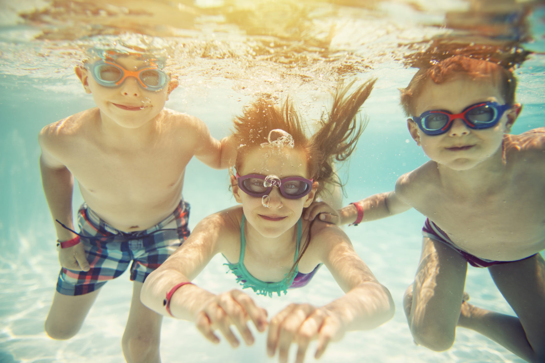 Kids Swimming Underwater